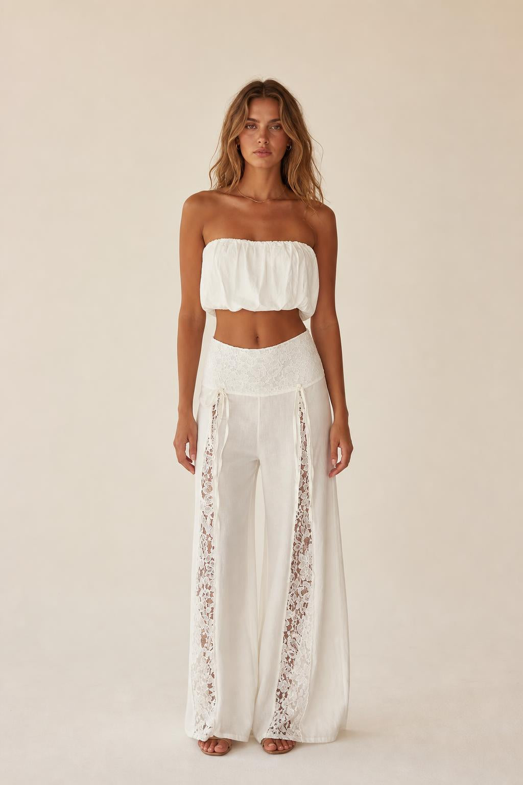 Front view of the white boho lace panel tube top and wide leg pants set