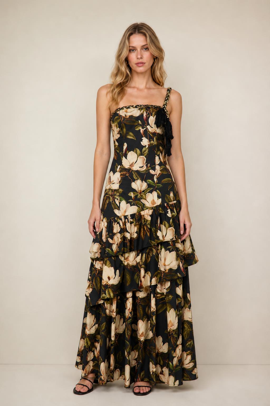 Front view of floral print tiered maxi dress in black on a model