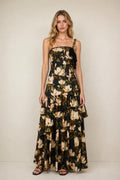 Front view of floral print tiered maxi dress in black on a model