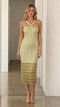 Model wearing olive green halter fringe midi dress, front view