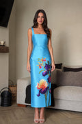Front view of blue floral midi dress on model