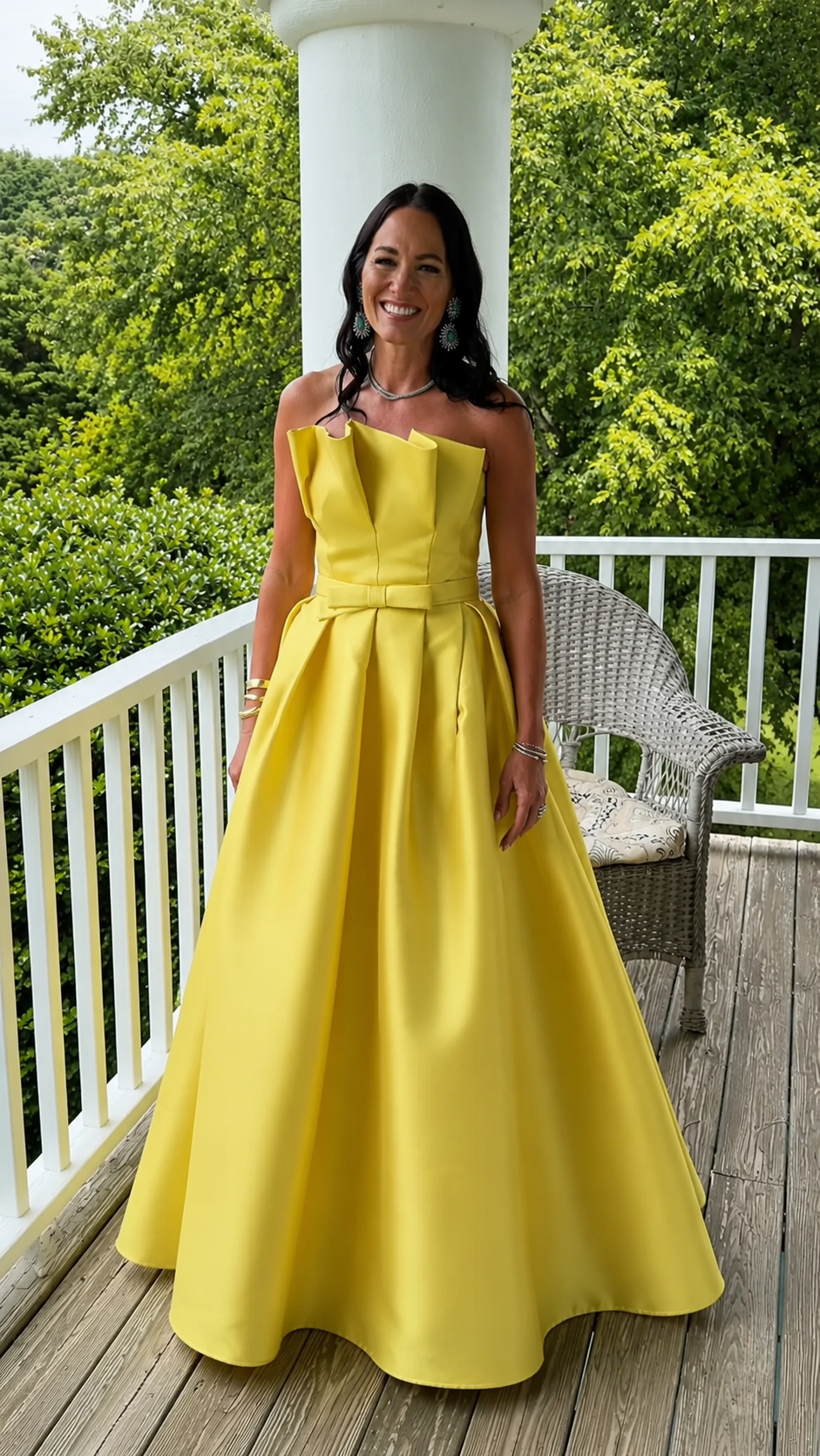Front view of yellow strapless foldover neckline A-line maxi gown