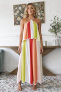 Model wearing multicolor scalloped panel halter maxi dress front view