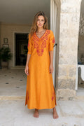 Front view of model wearing yellow embroidered maxi dress