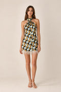 Front view of model wearing geometric halter mini dress with feather hem