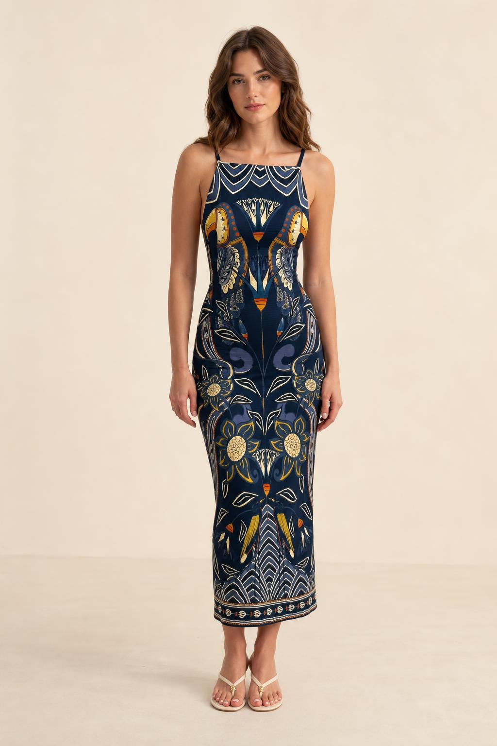 Full length front view of model wearing Navy printed midi dress