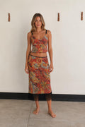 Front view of woman wearing Red Multi boho paisley crop top and fringe midi skirt set