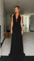 Front view of black beaded halter pleated maxi dress