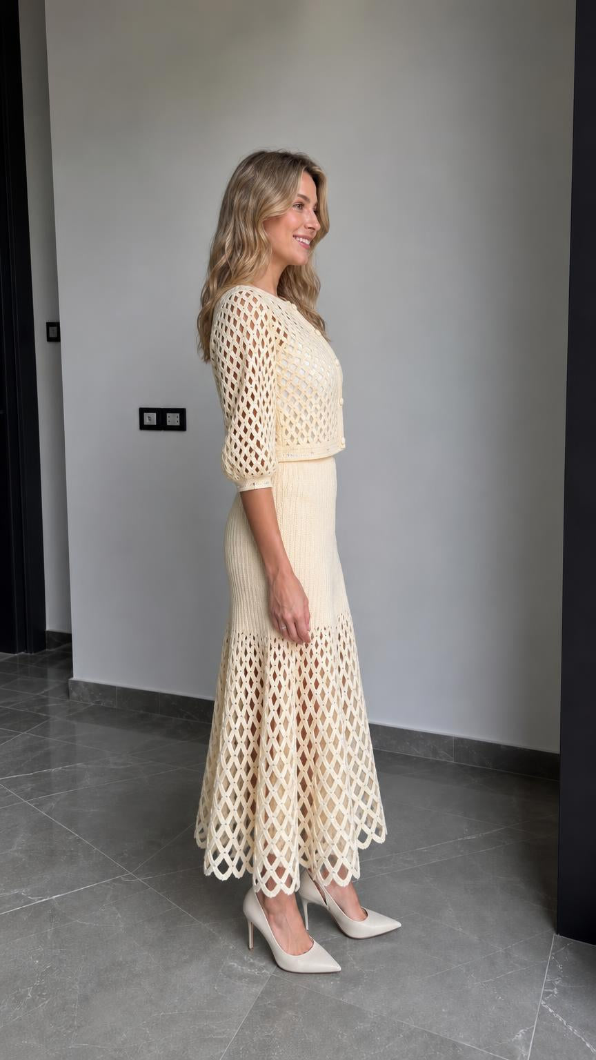 Side profile view of cream knit two-piece outfit