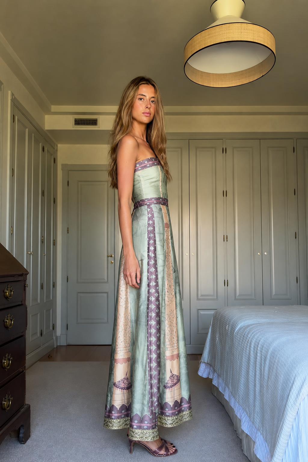 Side profile of model in Sage Green maxi dress