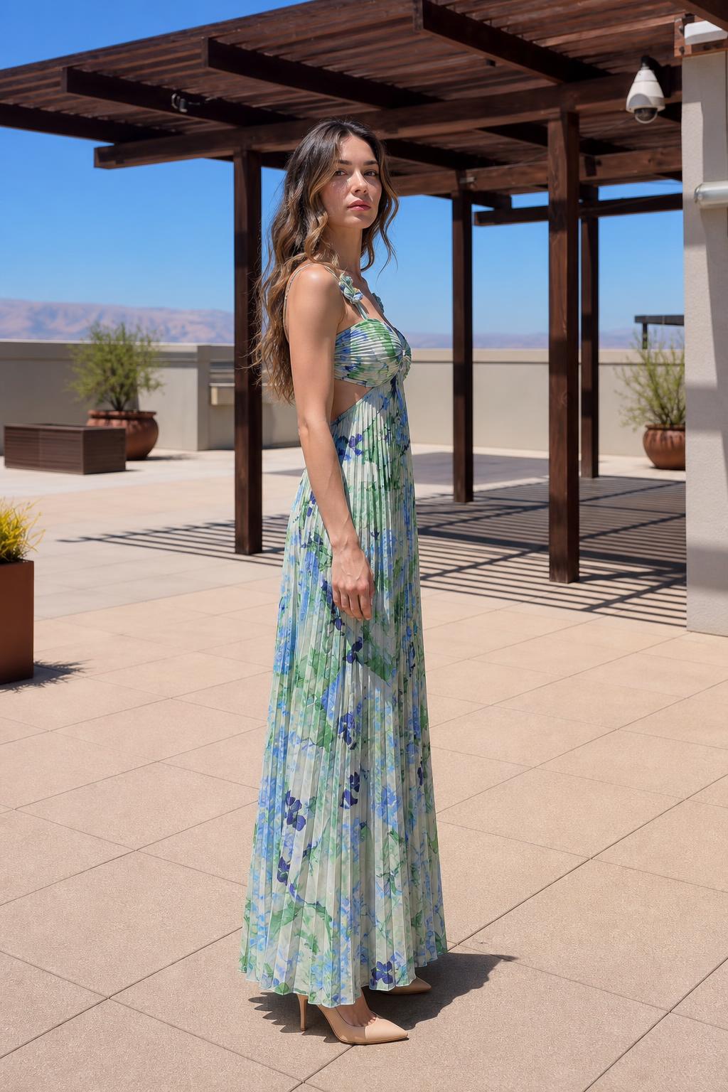 Side profile view of Green Floral pleated maxi dress