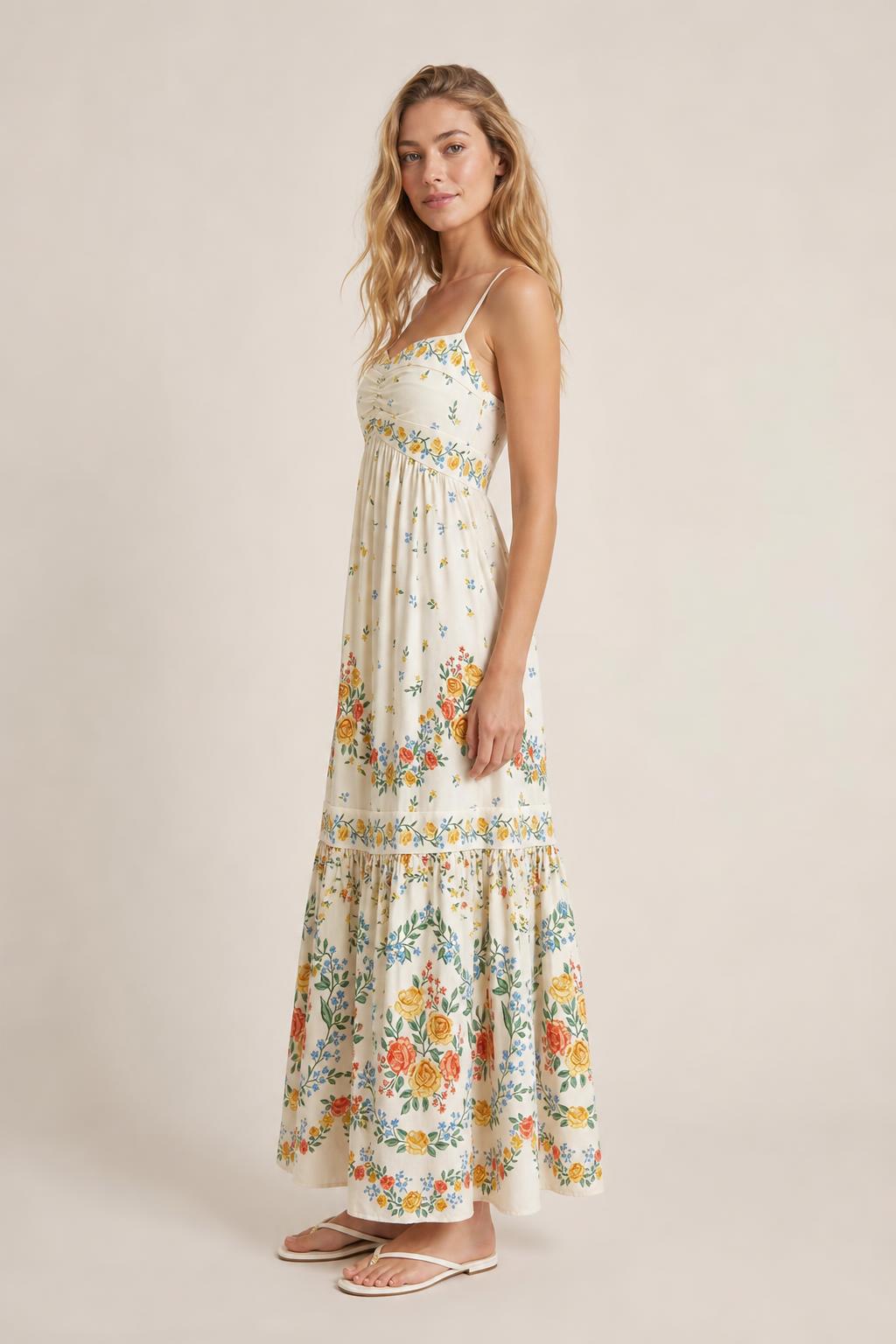 Side profile view of cream floral maxi dress