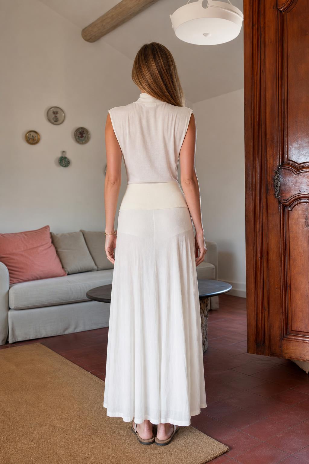 Back view of model in white knit maxi dress