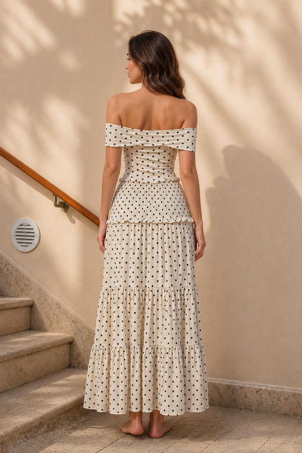 Model wearing cream polka dot maxi dress, back view