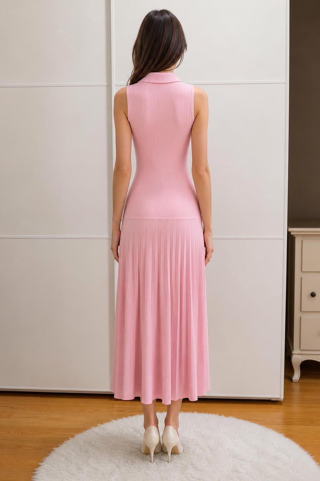 Back view of woman wearing pink polo knit midi dress