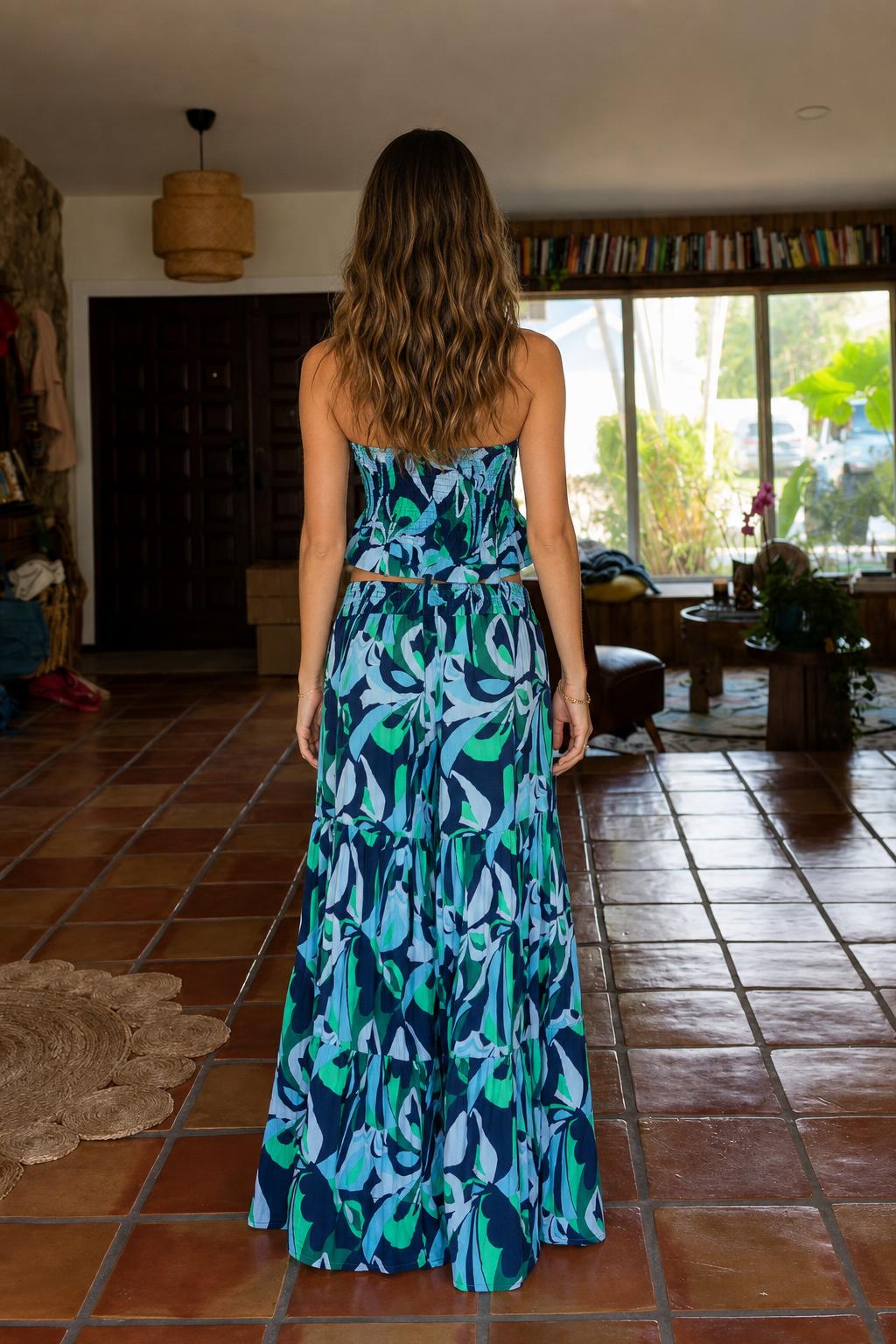 Back view of model wearing blue tropical print two-piece set