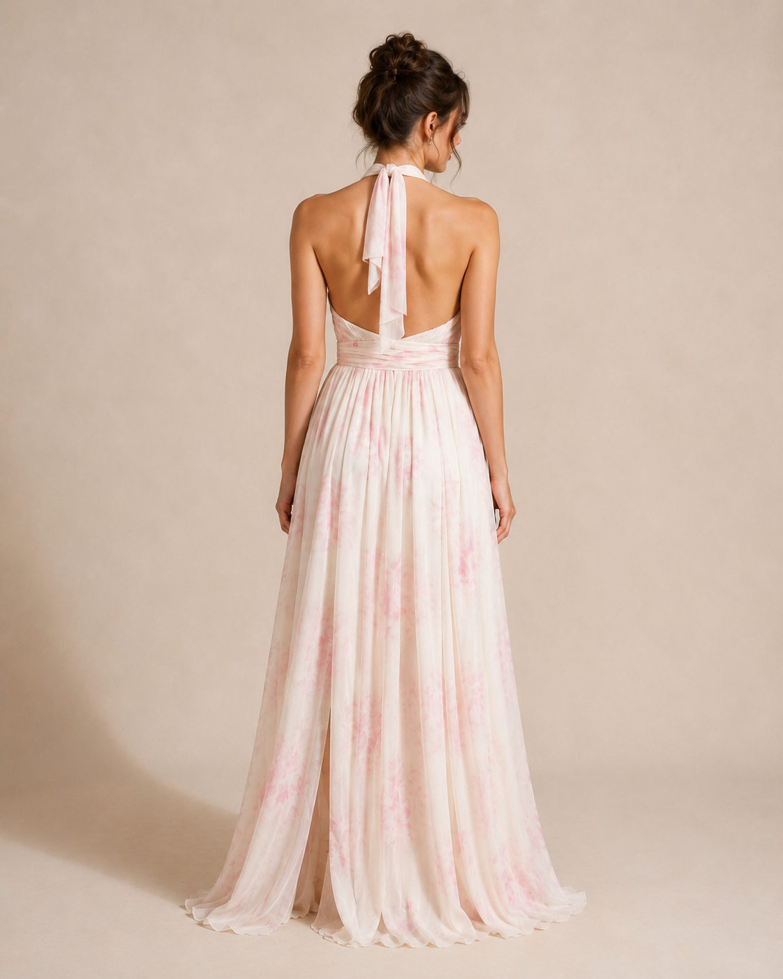 Back view of blush floral halter maxi dress with open back and tie neck