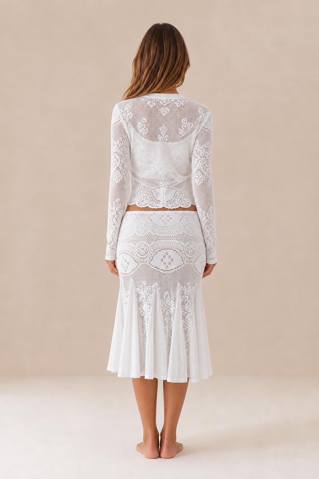 Back view of white crochet lace cardigan and matching skirt