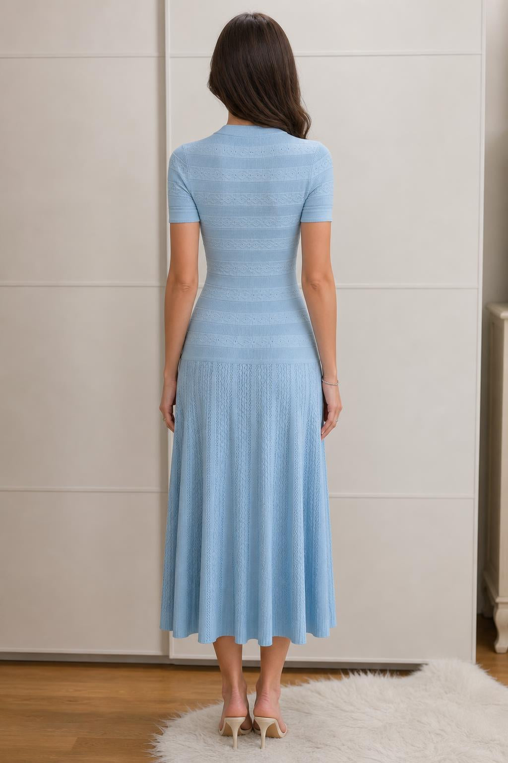Back view of light blue knit midi dress
