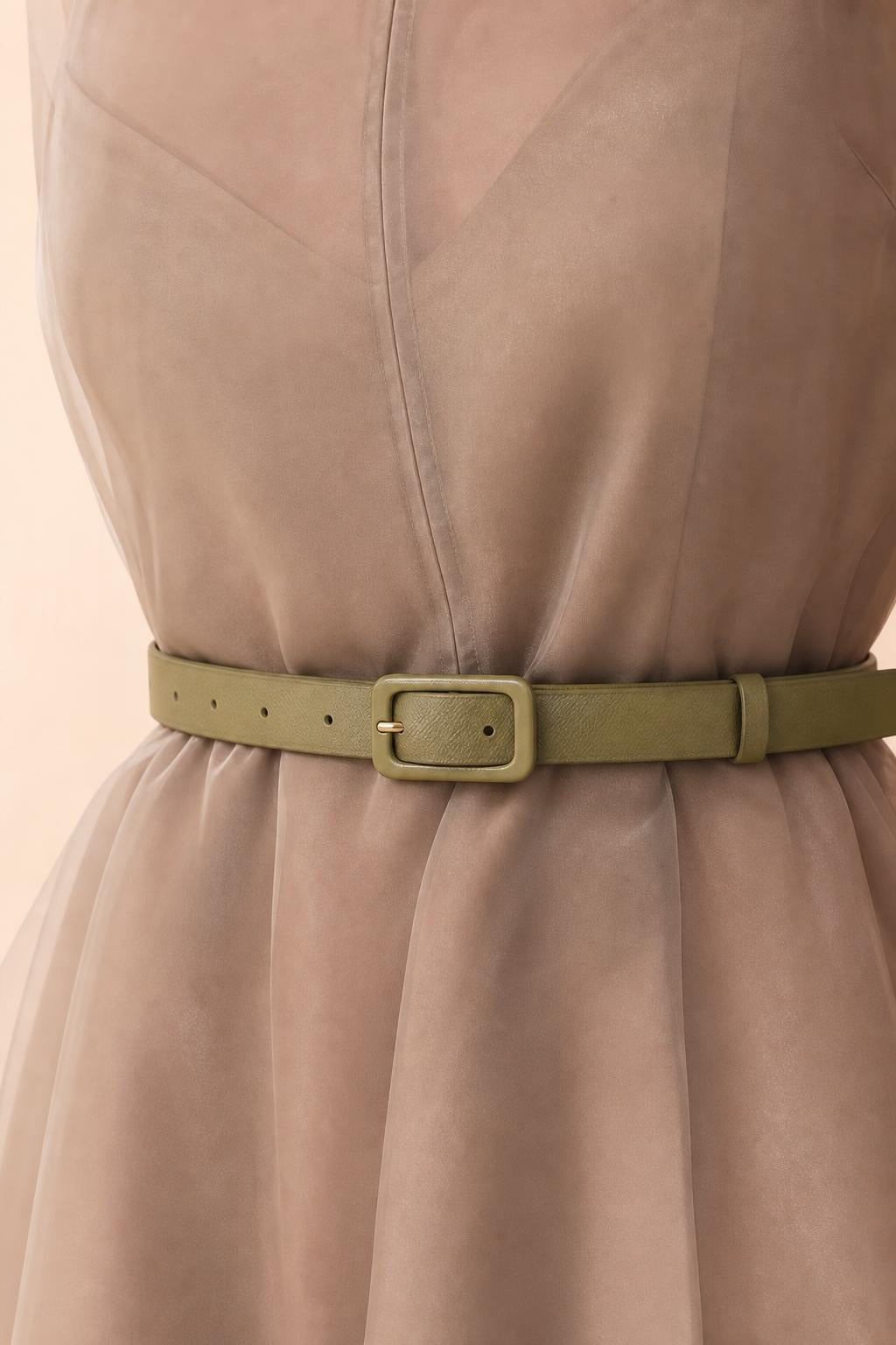 Close-up of organza fabric texture and matching belt detail