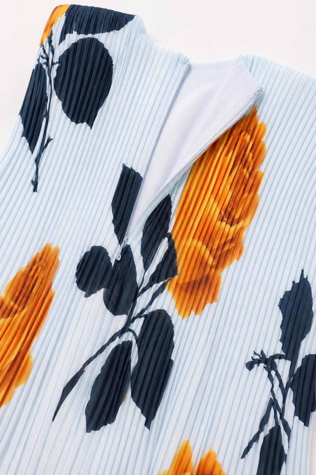 Close-up of fabric texture and back zipper on light blue dress