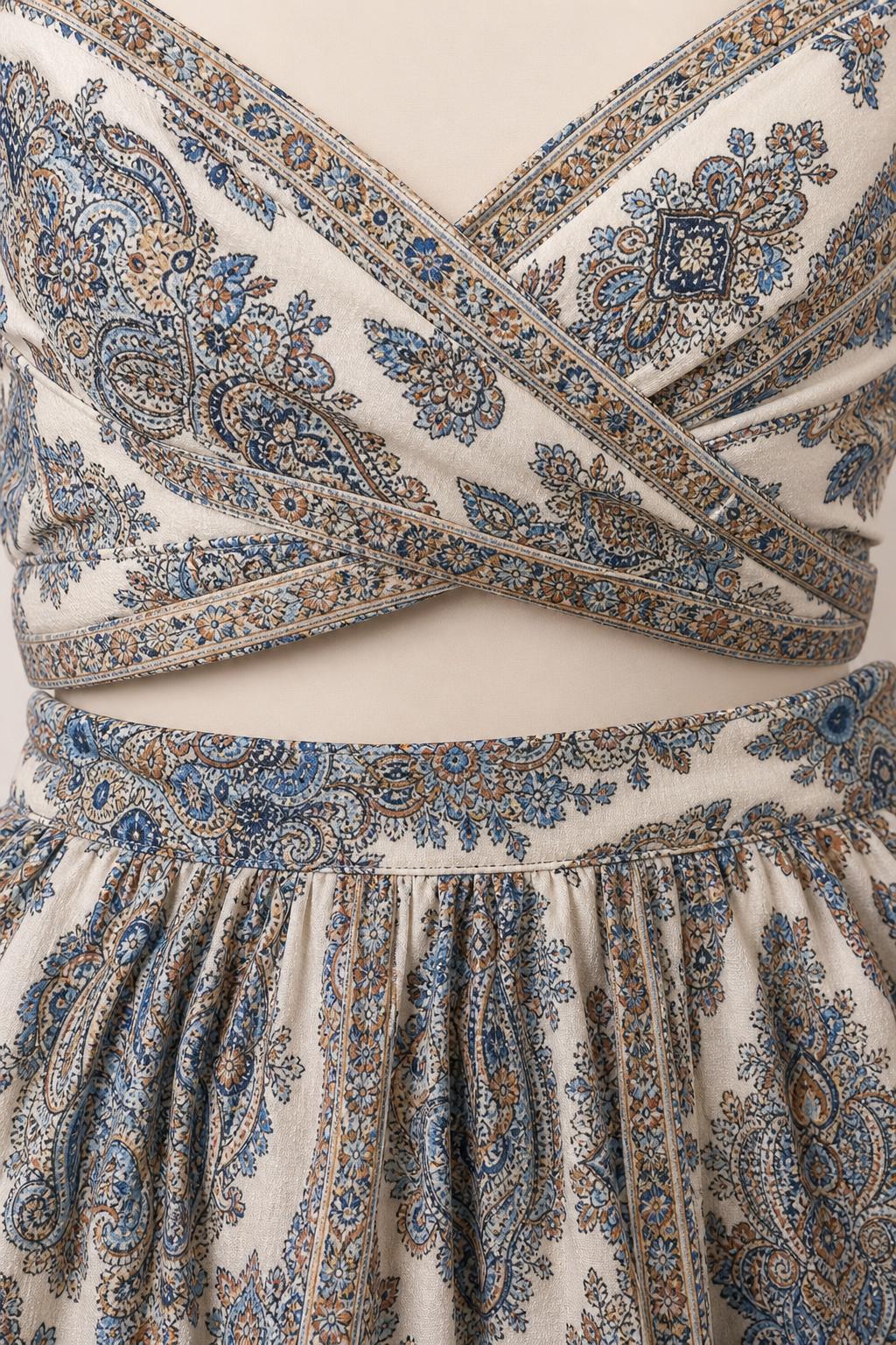 Close-up detail of the paisley wrap crop top and skirt waistband