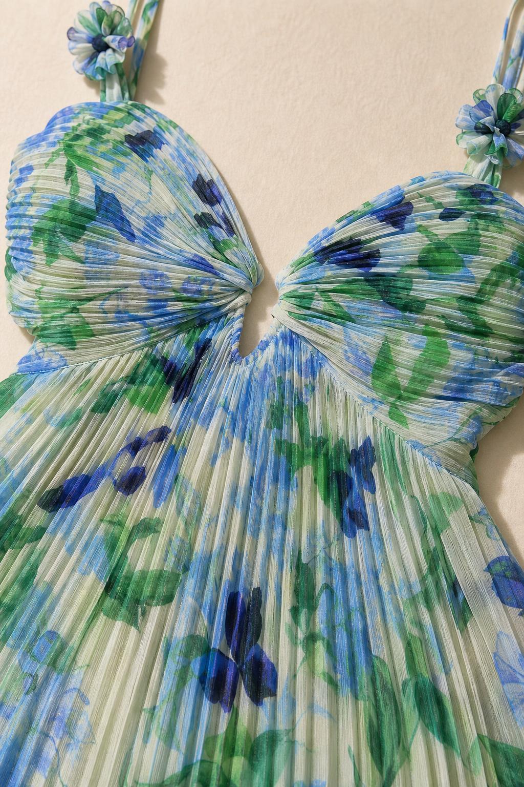 Close-up detail of pleated bodice and floral print