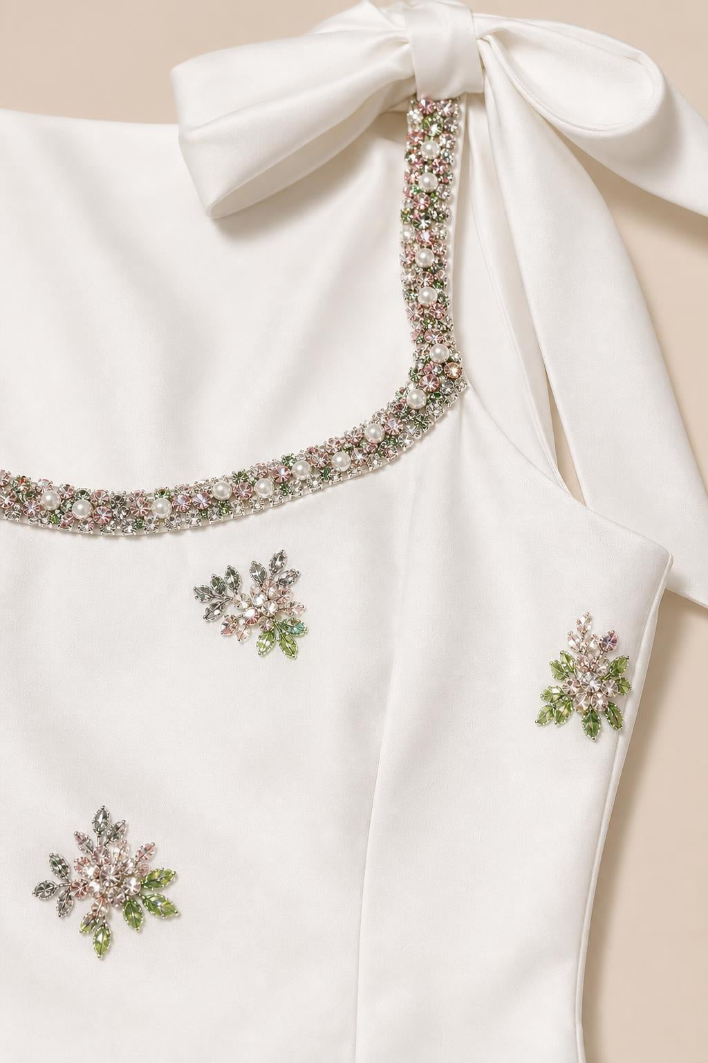 Close-up detail of crystal beaded neckline and floral appliques