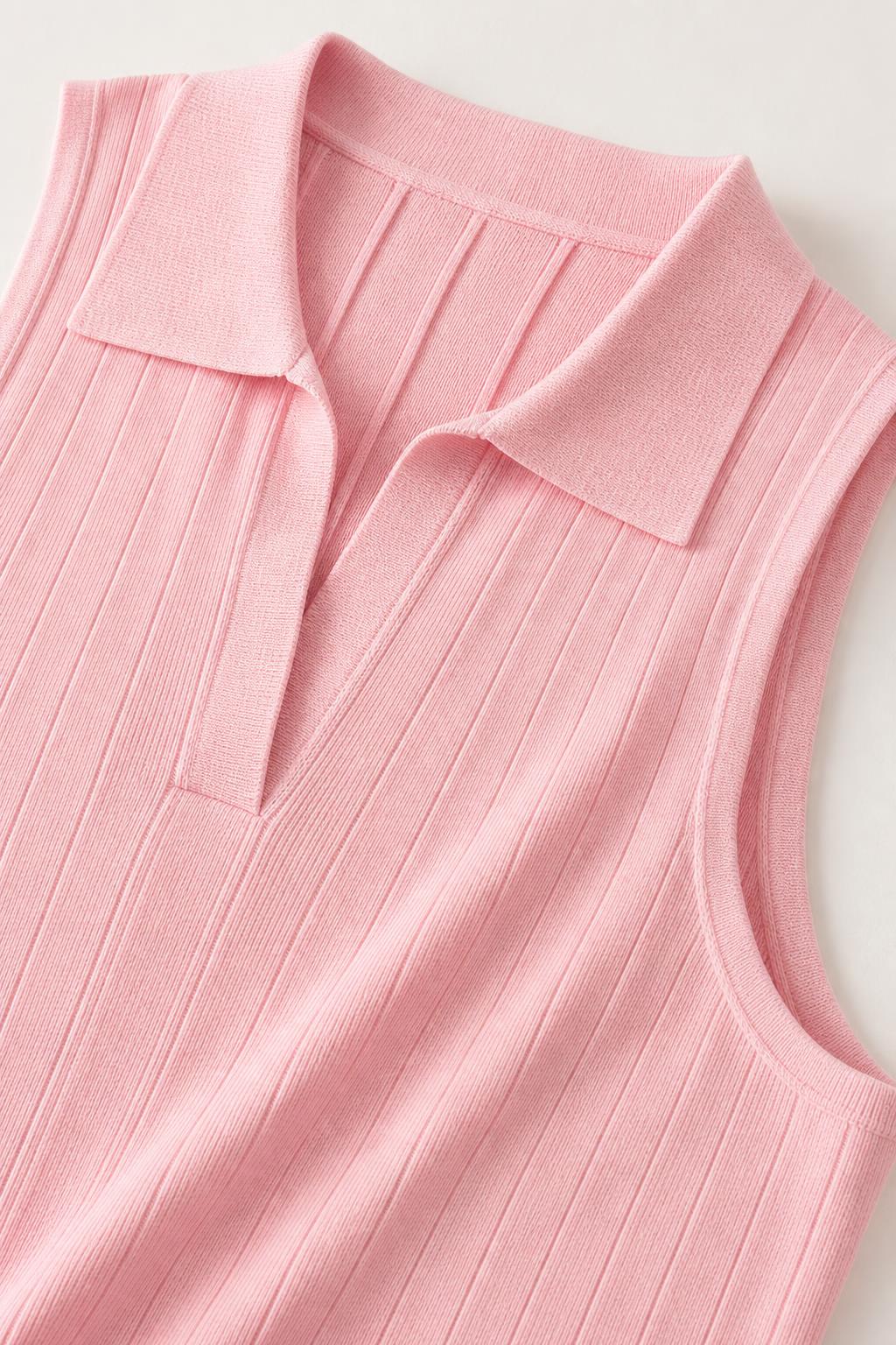 Close-up detail of the polo collar and ribbed texture on pink knit dress