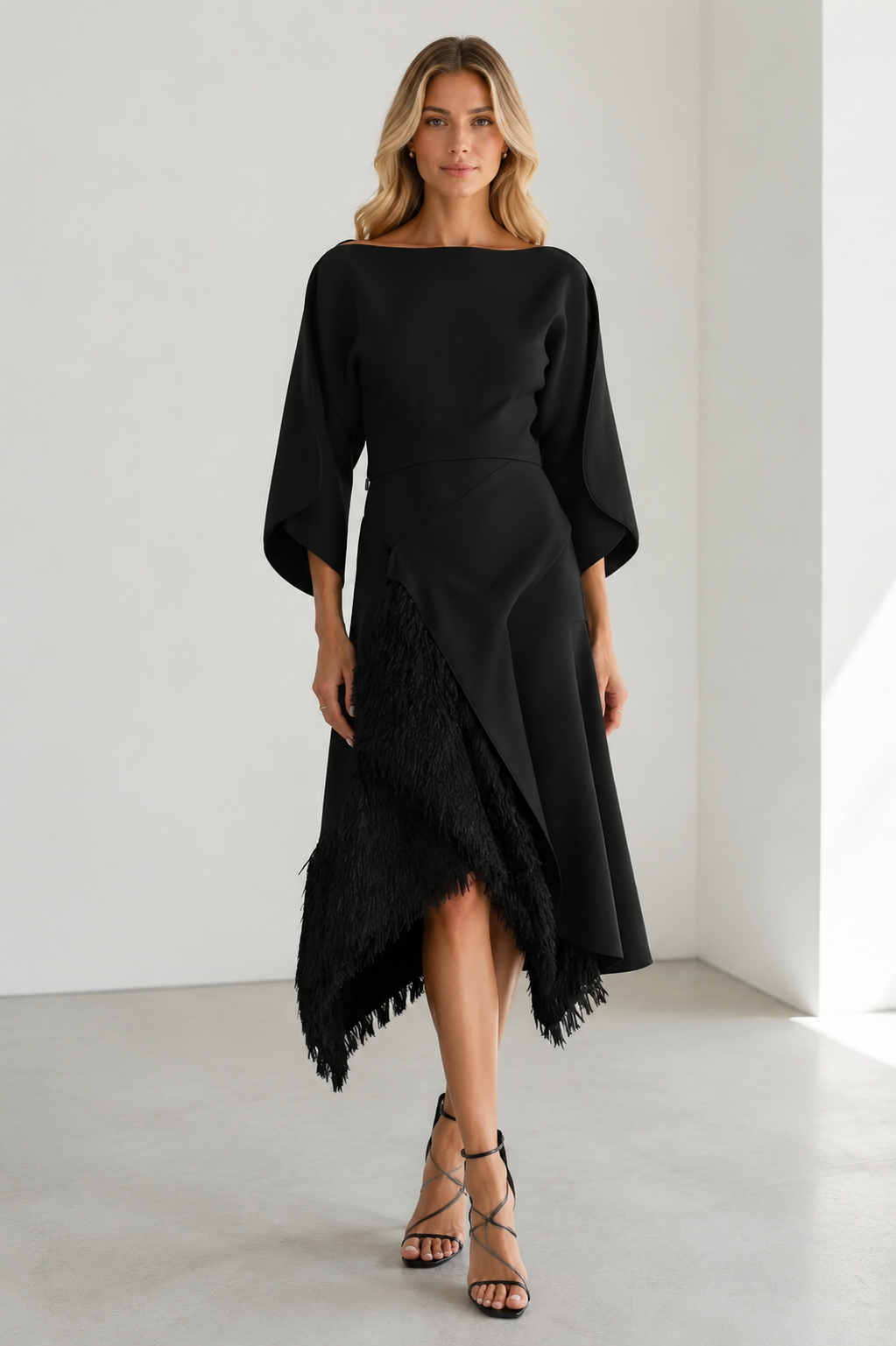 Black asymmetric midi dress with boat neckline and fringe-trim skirt