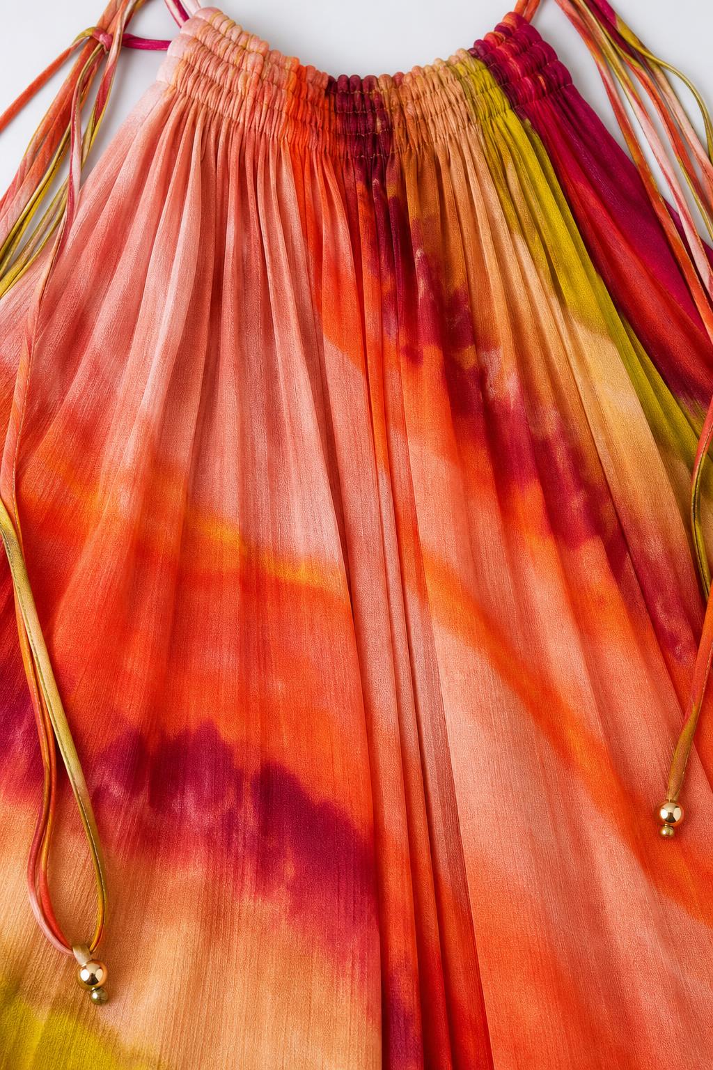 Close-up detail of pleated texture and orange ombre gradient