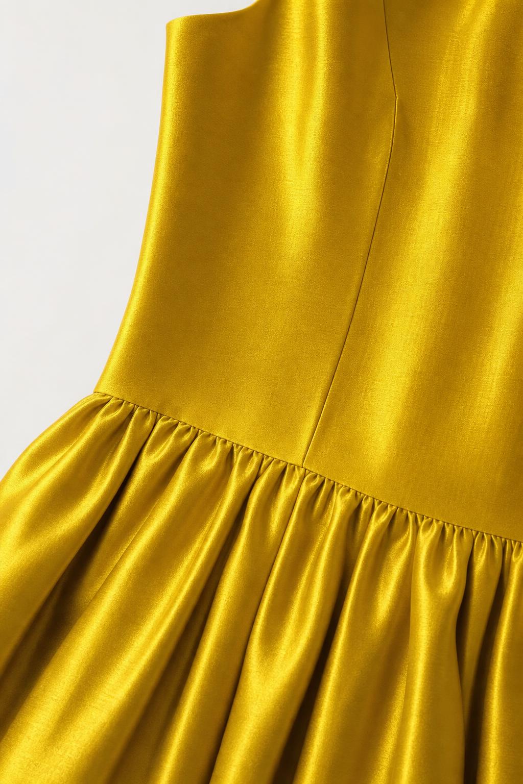 Close-up detail of satin fabric and gathered dropped waist