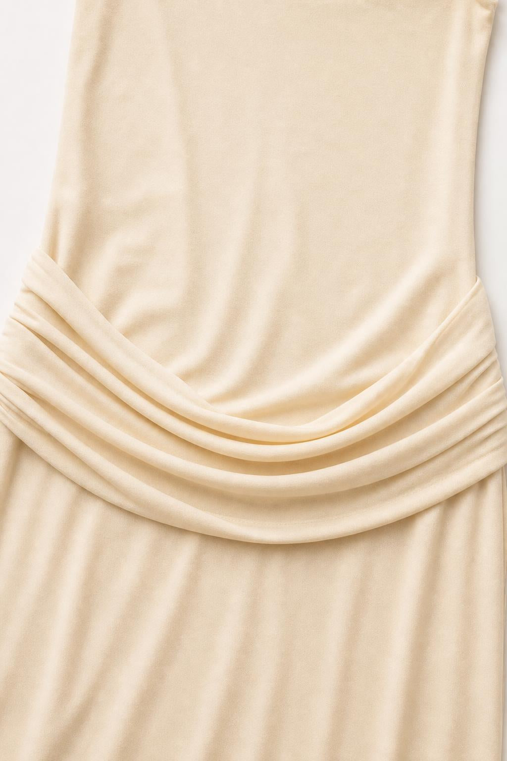 Close-up detail of the waist draping on the Champagne dress
