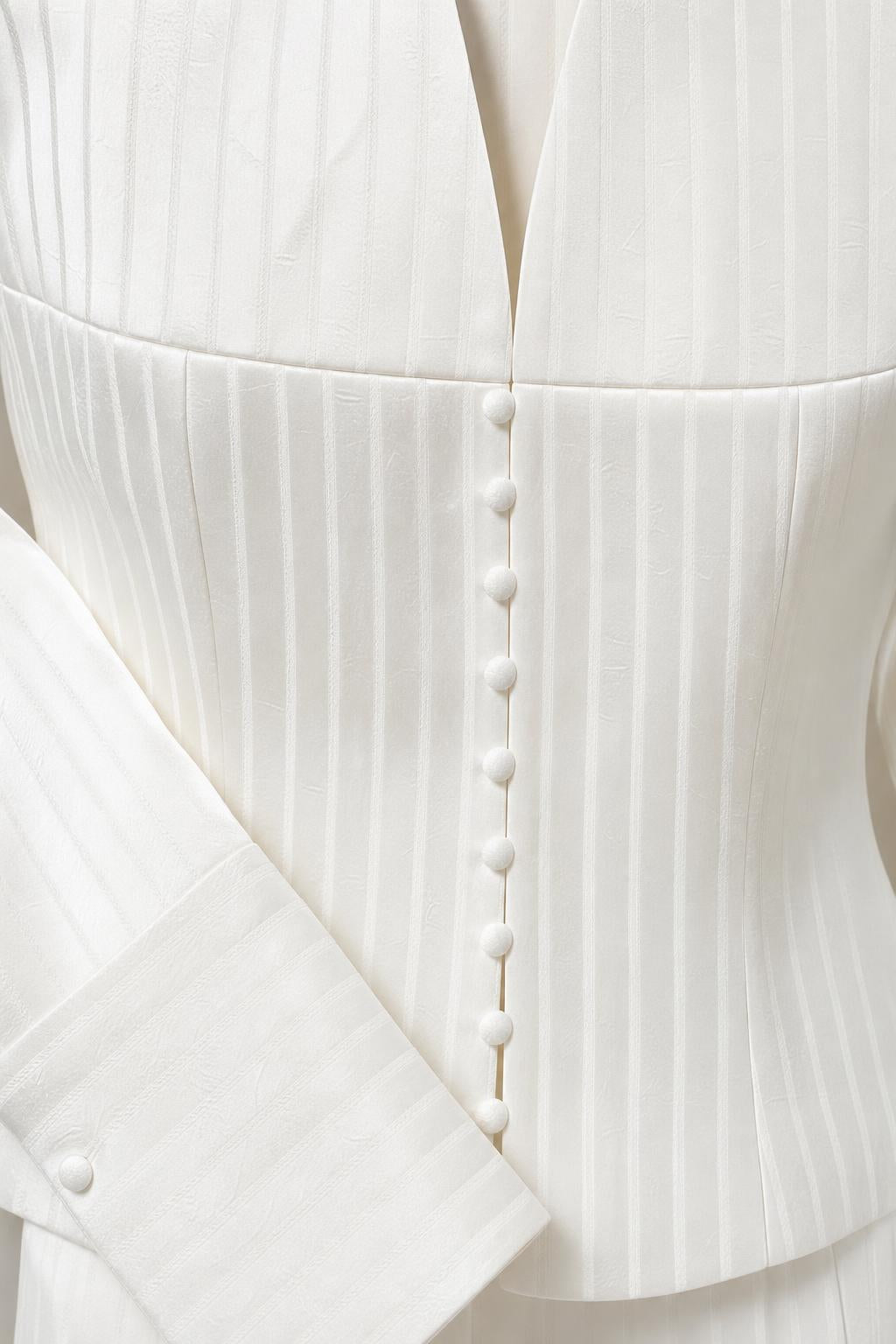 Close-up of jacket buttons and pinstripe texture