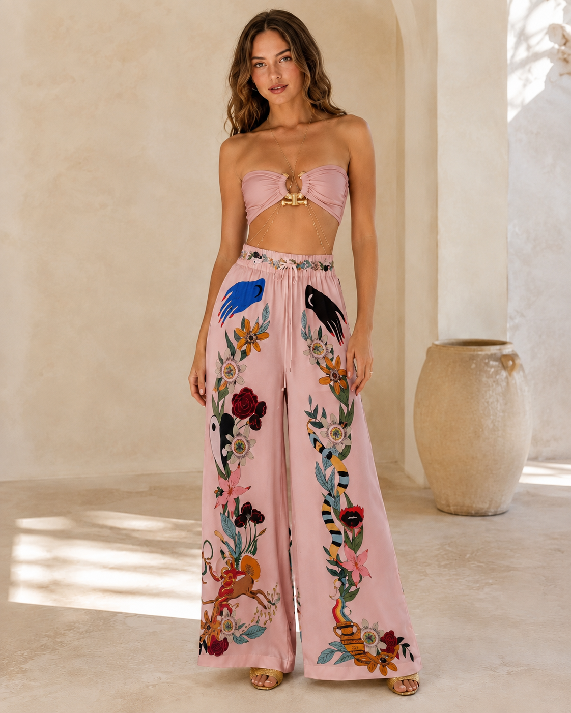 Front view of blush pink bandeau top and matching printed wide-leg pants set