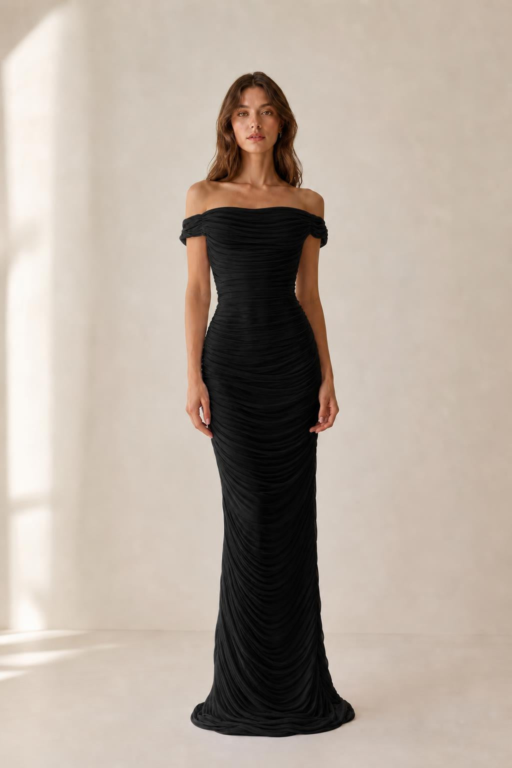 Front view of black off-the-shoulder ruched evening dress