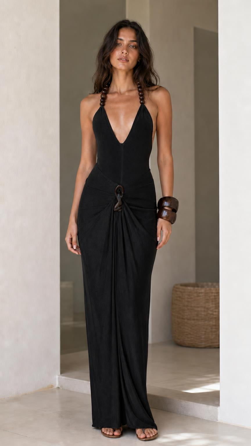 Model wearing black halter maxi dress