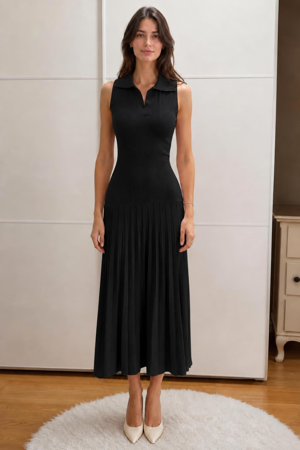 Front view of woman wearing black sleeveless polo knit midi dress