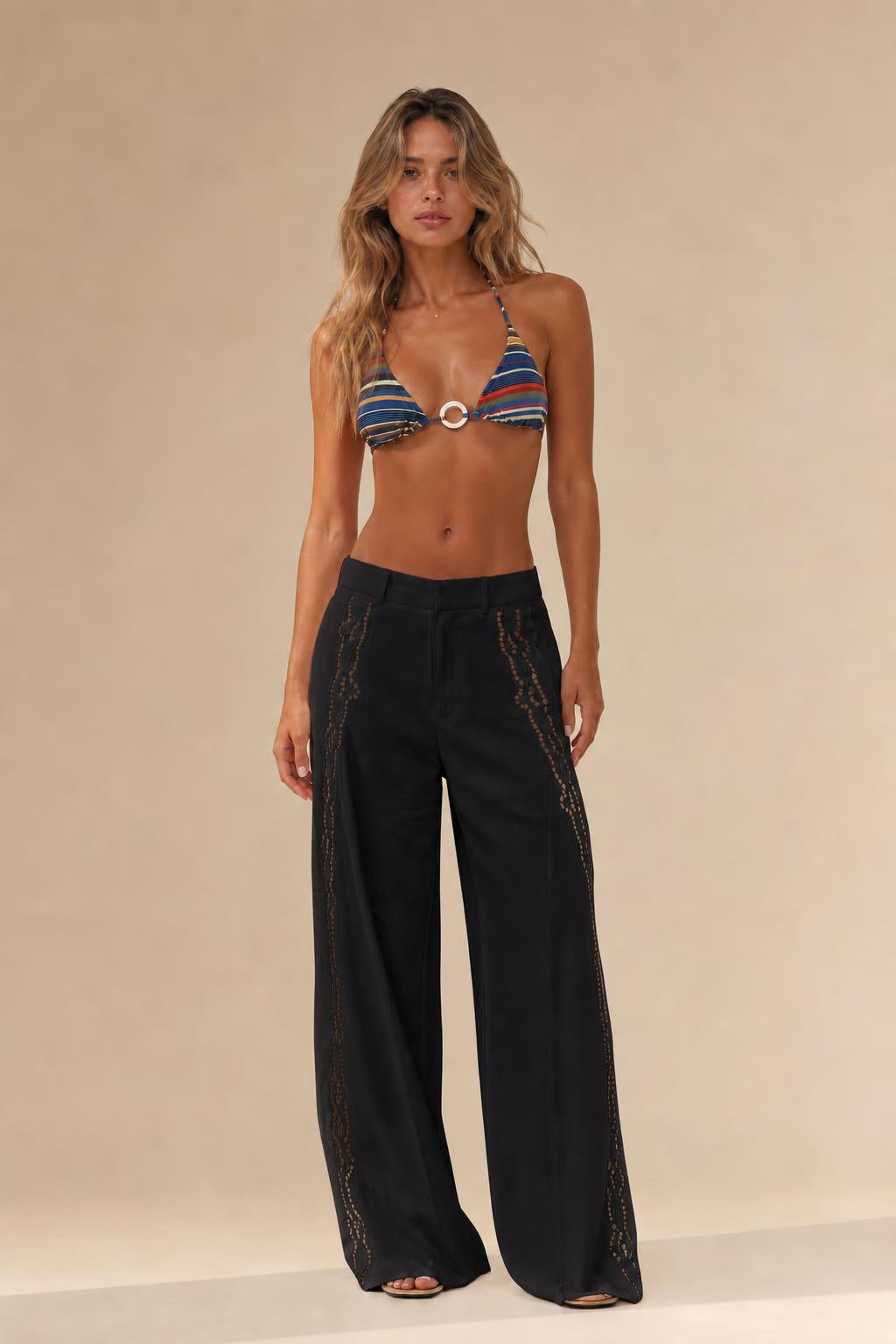Woman wearing black cutout wide leg trousers