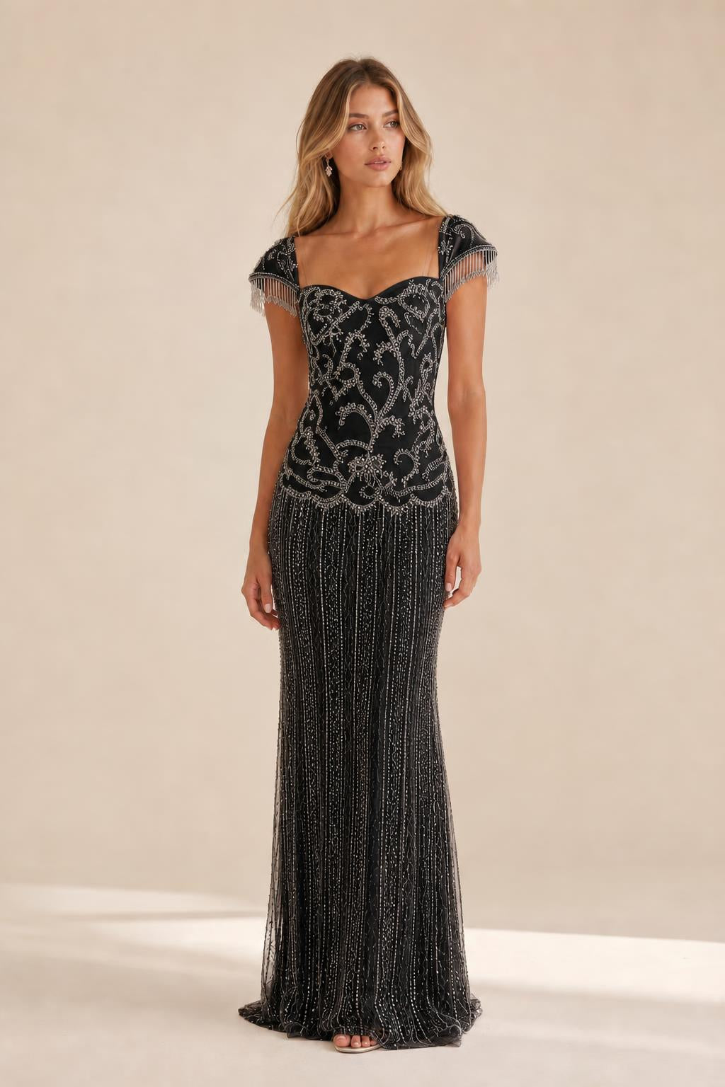 Front view of the black beaded evening gown