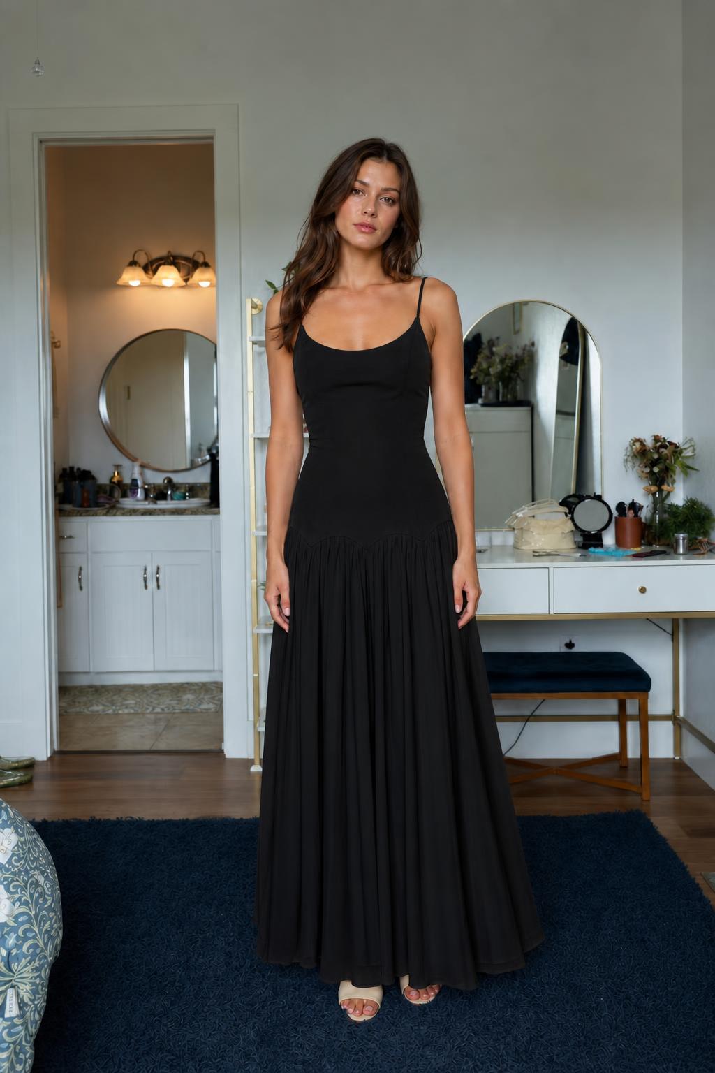 Front view of solid black pleated maxi dress