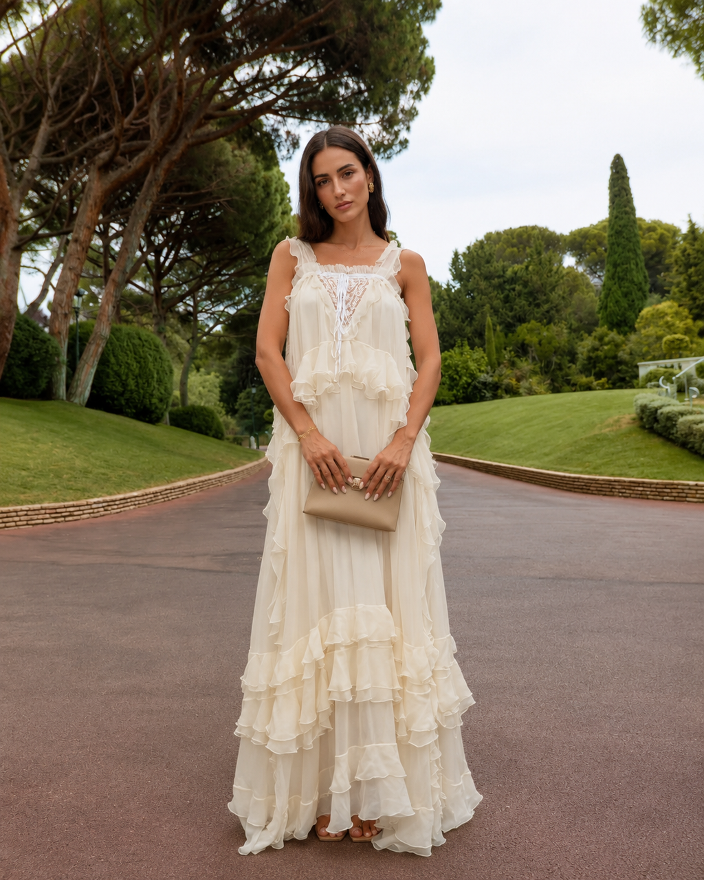 Front view of cream ruffle strap maxi dress with flowing layered silhouette