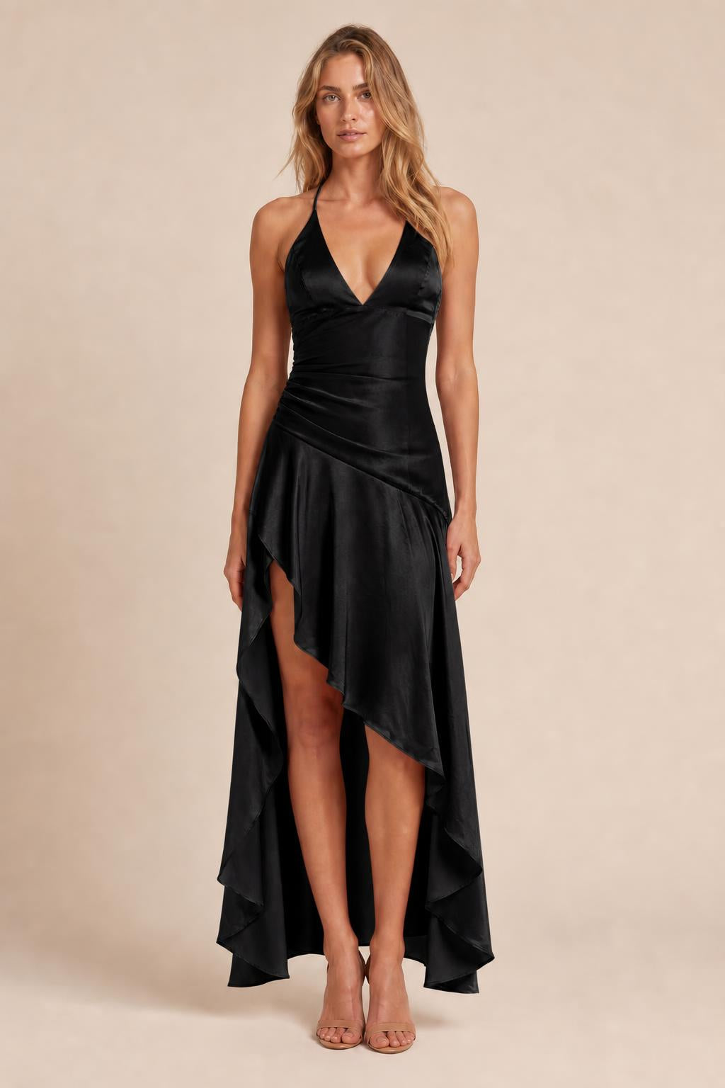 Model wearing black satin halter high-low evening dress