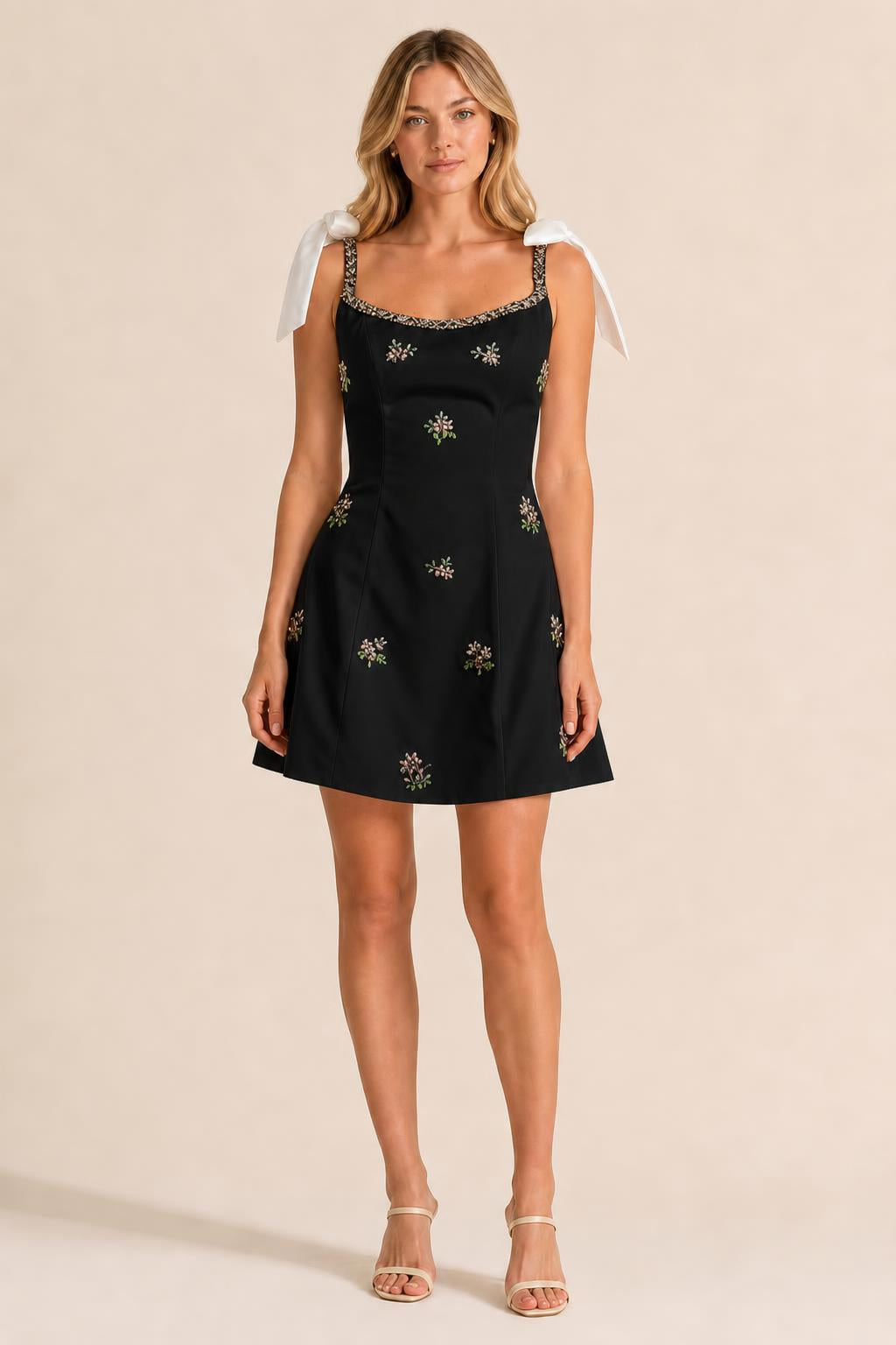 Front view of black embellished mini dress