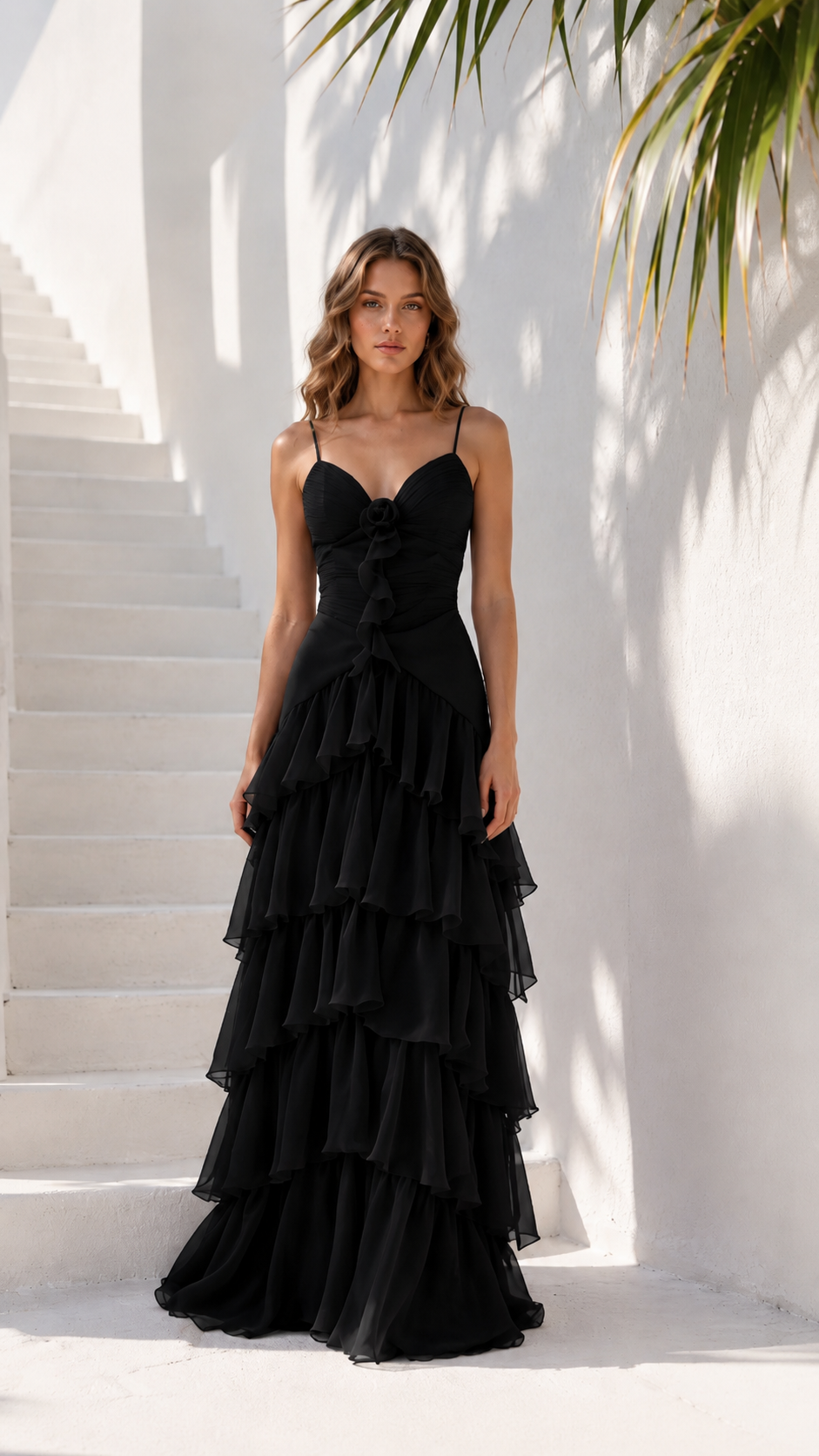 Front view of black tiered ruffle maxi dress with fitted bodice