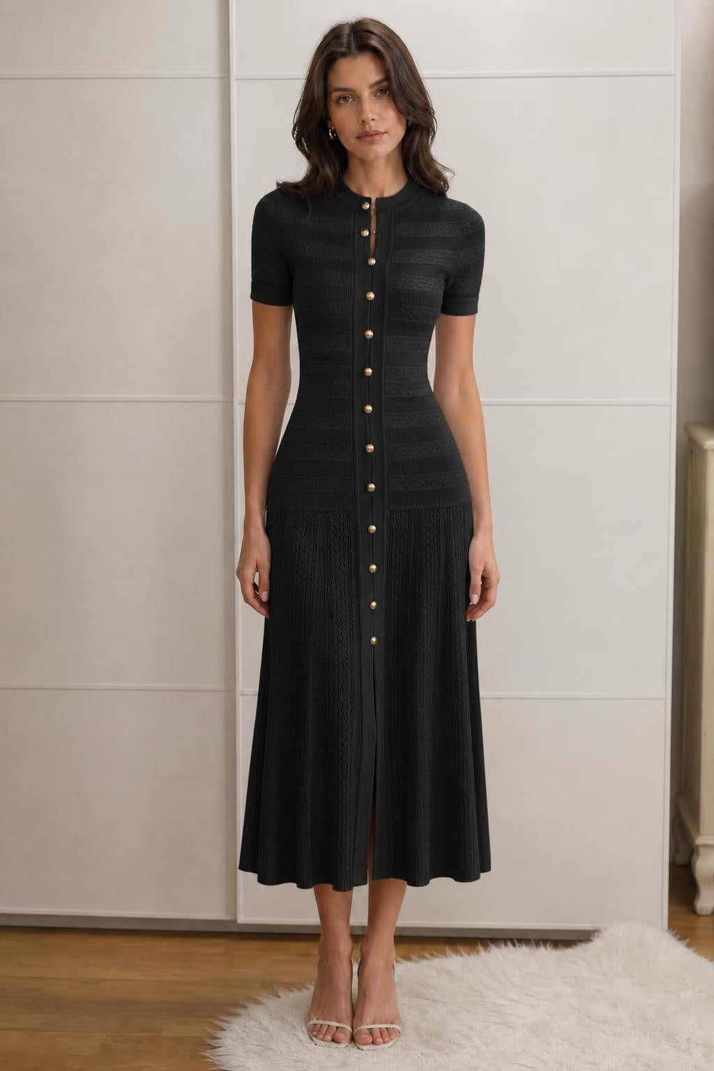 Front view of black knit midi dress on model