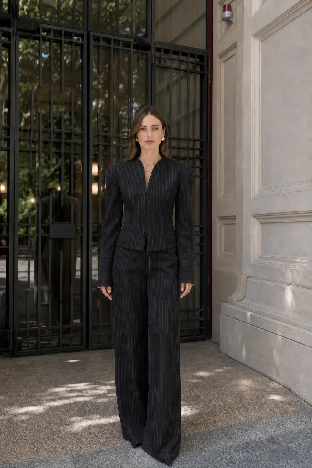 Model wearing black pinstripe suit