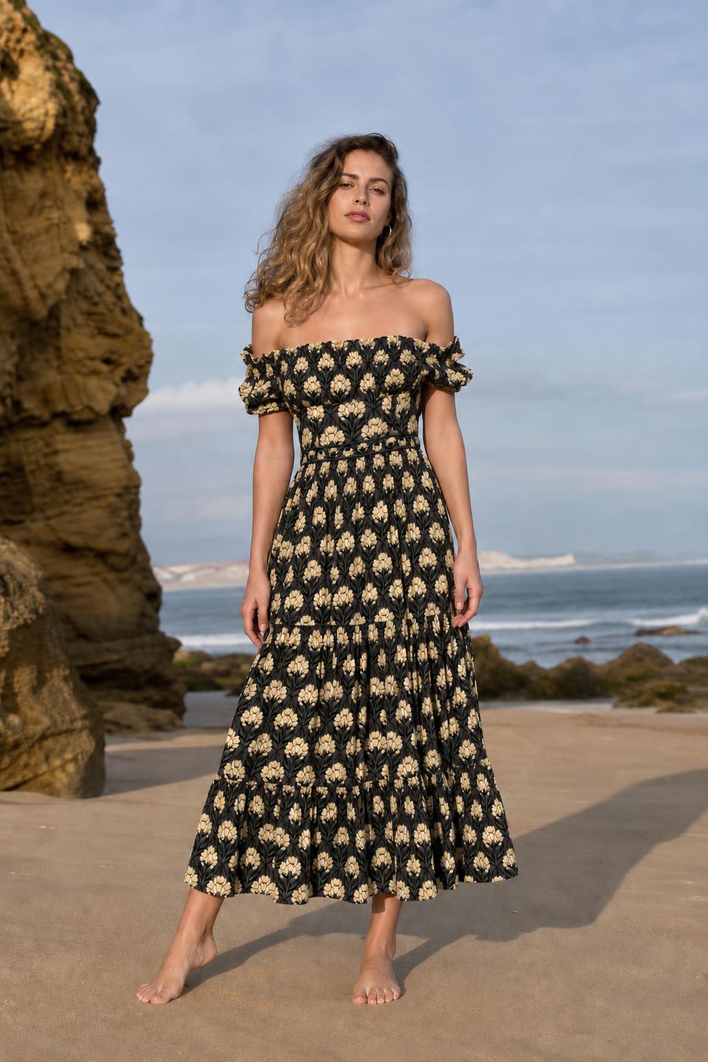 Woman wearing black floral off-the-shoulder midi dress