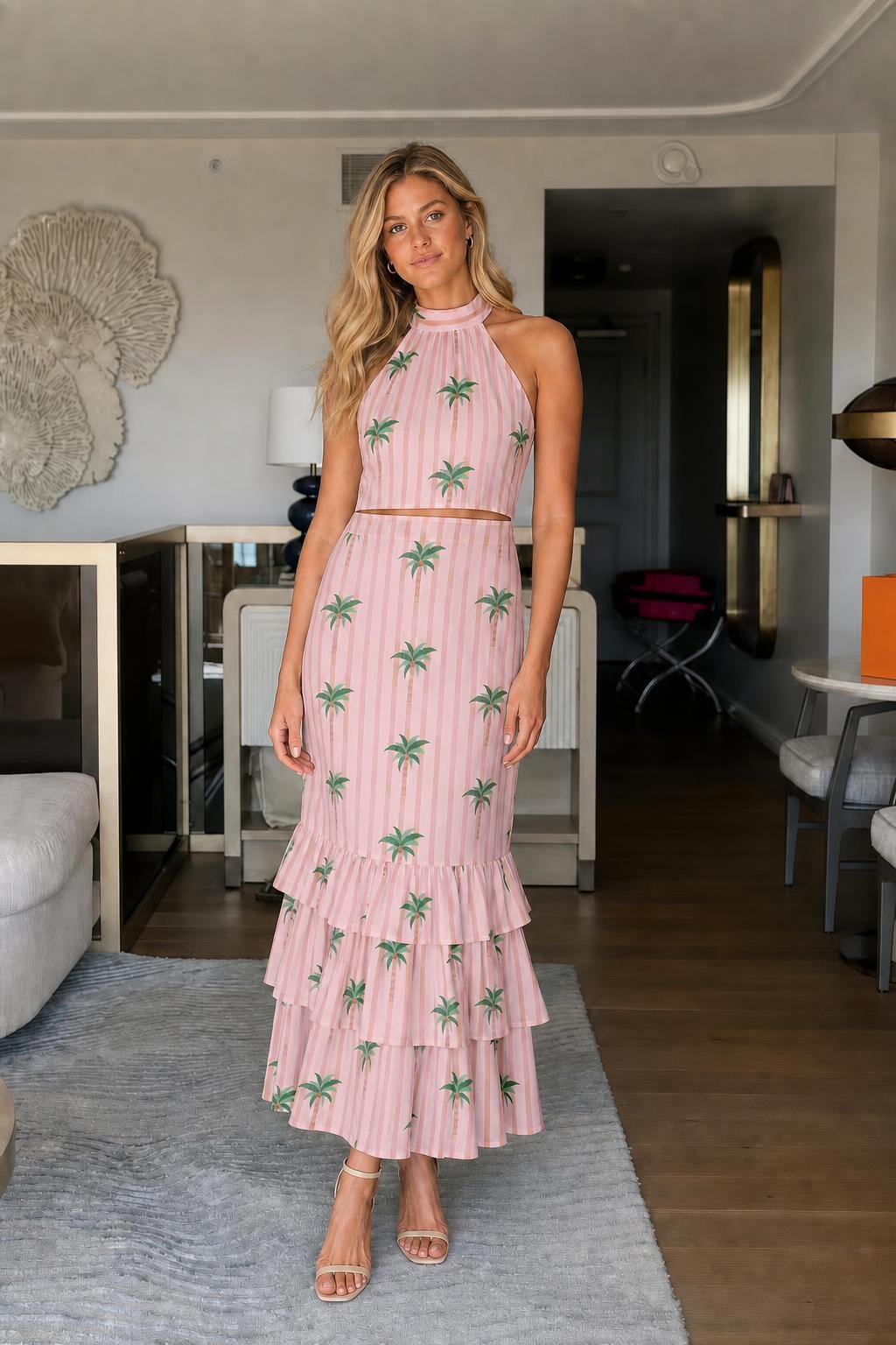 Model wearing pink palm tree print two-piece set