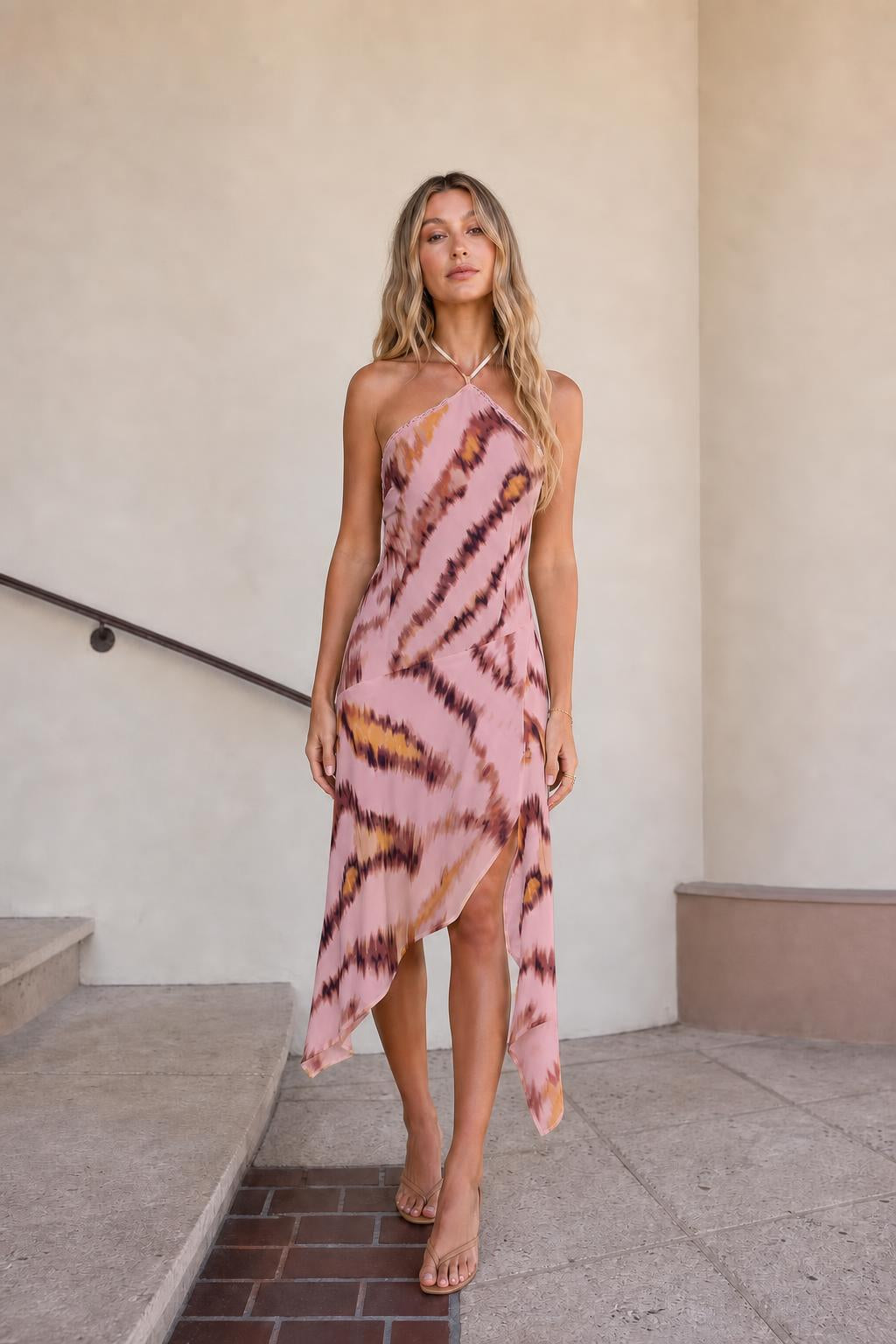 Front view of pink printed halter midi dress